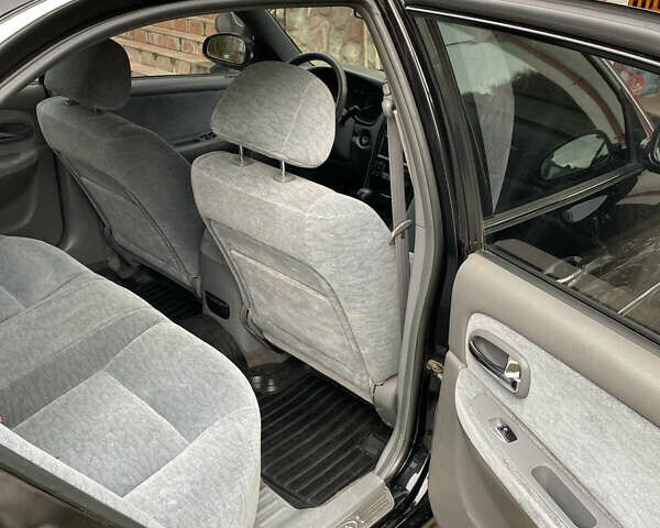 Чорний Кіа Маджентіс, об'ємом двигуна 2 л та пробігом 120 тис. км за 5800 $, фото 13 на Automoto.ua