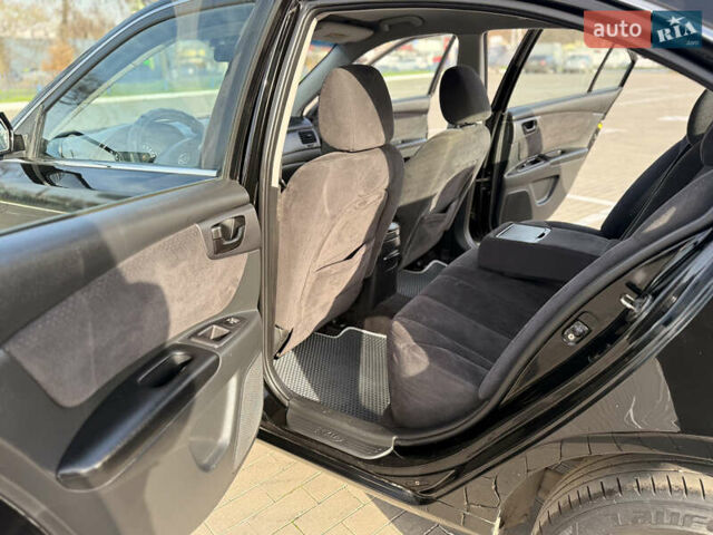 Черный Киа Маджентис, объемом двигателя 2 л и пробегом 260 тыс. км за 5400 $, фото 13 на Automoto.ua