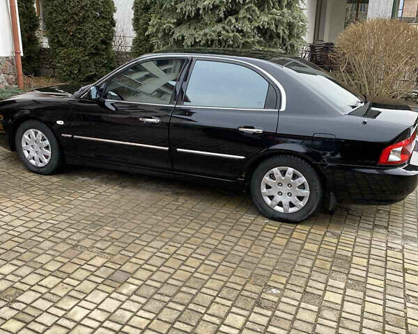 Чорний Кіа Маджентіс, об'ємом двигуна 2 л та пробігом 120 тис. км за 5800 $, фото 5 на Automoto.ua