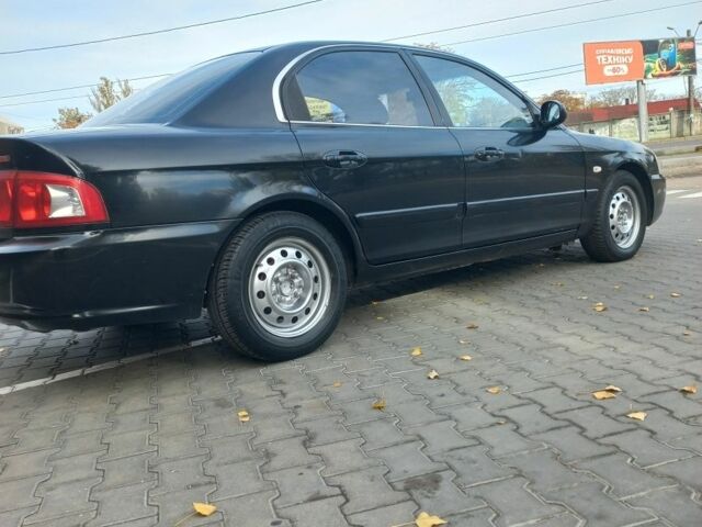 Чорний Кіа Маджентіс, об'ємом двигуна 2 л та пробігом 195 тис. км за 3500 $, фото 3 на Automoto.ua