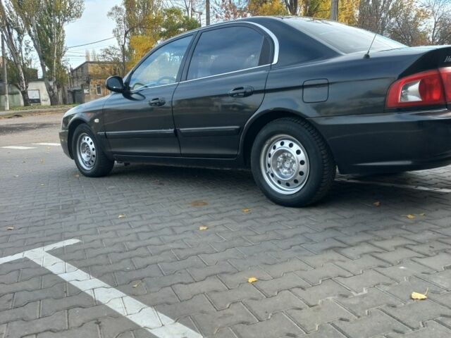 Чорний Кіа Маджентіс, об'ємом двигуна 2 л та пробігом 195 тис. км за 3500 $, фото 5 на Automoto.ua