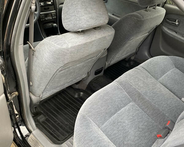 Чорний Кіа Маджентіс, об'ємом двигуна 2 л та пробігом 120 тис. км за 5800 $, фото 12 на Automoto.ua