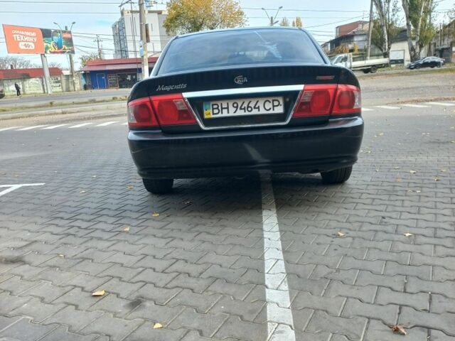Чорний Кіа Маджентіс, об'ємом двигуна 2 л та пробігом 195 тис. км за 3500 $, фото 4 на Automoto.ua
