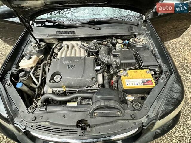 Чорний Кіа Маджентіс, об'ємом двигуна 2.66 л та пробігом 218 тис. км за 4600 $, фото 28 на Automoto.ua