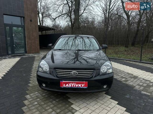 Чорний Кіа Маджентіс, об'ємом двигуна 2 л та пробігом 302 тис. км за 5800 $, фото 1 на Automoto.ua