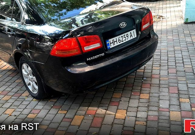 Чорний Кіа Маджентіс, об'ємом двигуна 2 л та пробігом 215 тис. км за 5750 $, фото 1 на Automoto.ua