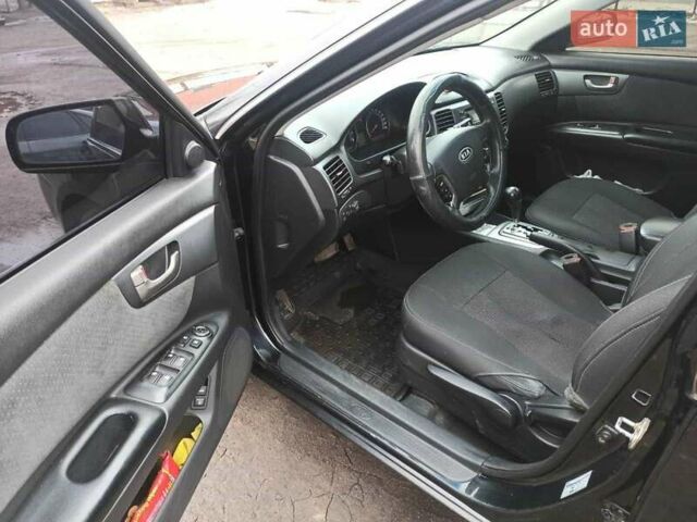 Черный Киа Маджентис, объемом двигателя 2 л и пробегом 322 тыс. км за 5000 $, фото 9 на Automoto.ua