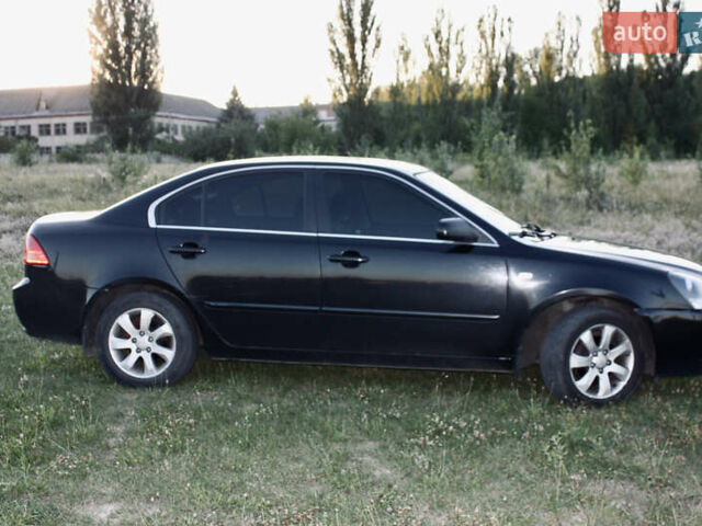 Чорний Кіа Маджентіс, об'ємом двигуна 2 л та пробігом 380 тис. км за 4600 $, фото 4 на Automoto.ua