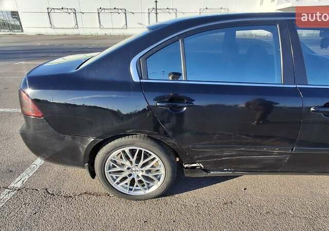 Чорний Кіа Маджентіс, об'ємом двигуна 2 л та пробігом 373 тис. км за 4500 $, фото 6 на Automoto.ua