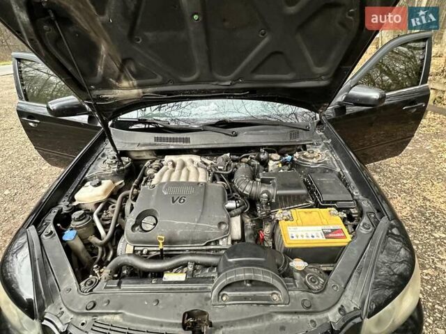 Чорний Кіа Маджентіс, об'ємом двигуна 2.66 л та пробігом 218 тис. км за 4600 $, фото 27 на Automoto.ua