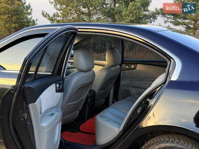 Черный Киа Маджентис, объемом двигателя 2 л и пробегом 305 тыс. км за 5400 $, фото 11 на Automoto.ua