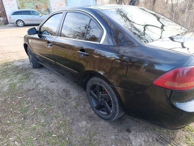 Черный Киа Маджентис, объемом двигателя 2 л и пробегом 400 тыс. км за 3400 $, фото 4 на Automoto.ua