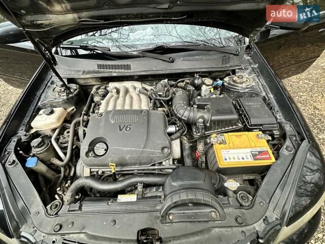 Чорний Кіа Маджентіс, об'ємом двигуна 2.66 л та пробігом 218 тис. км за 4600 $, фото 29 на Automoto.ua