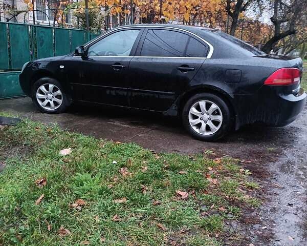 Чорний Кіа Маджентіс, об'ємом двигуна 2 л та пробігом 100 тис. км за 4800 $, фото 6 на Automoto.ua