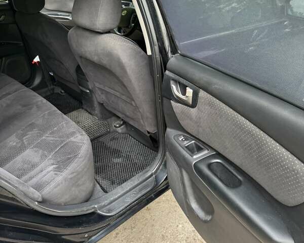 Черный Киа Маджентис, объемом двигателя 2 л и пробегом 302 тыс. км за 4500 $, фото 7 на Automoto.ua