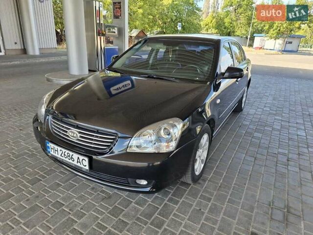 Чорний Кіа Маджентіс, об'ємом двигуна 2 л та пробігом 192 тис. км за 6600 $, фото 1 на Automoto.ua