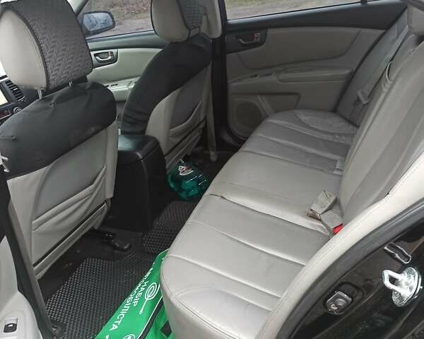 Черный Киа Маджентис, объемом двигателя 2 л и пробегом 226 тыс. км за 5500 $, фото 12 на Automoto.ua