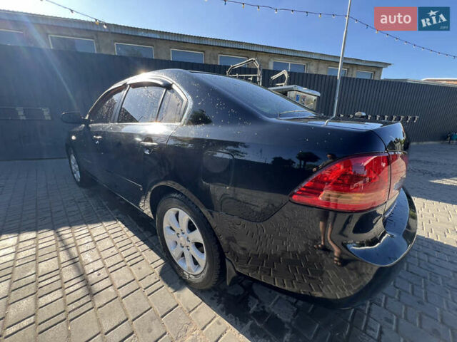 Черный Киа Маджентис, объемом двигателя 2 л и пробегом 195 тыс. км за 5559 $, фото 1 на Automoto.ua