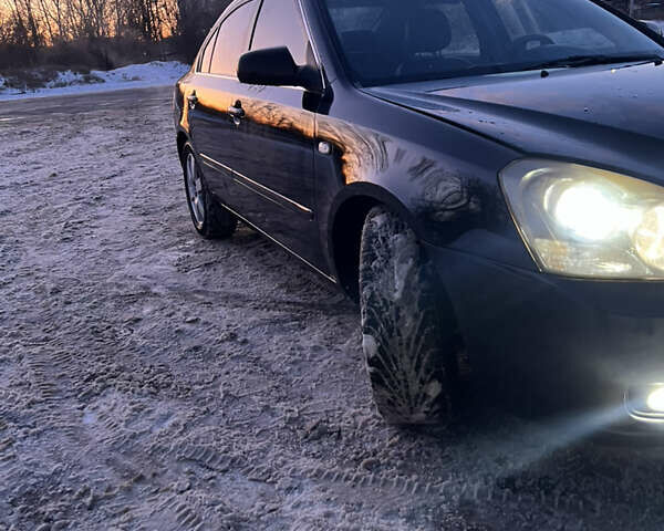 Черный Киа Маджентис, объемом двигателя 2.66 л и пробегом 307 тыс. км за 4800 $, фото 4 на Automoto.ua