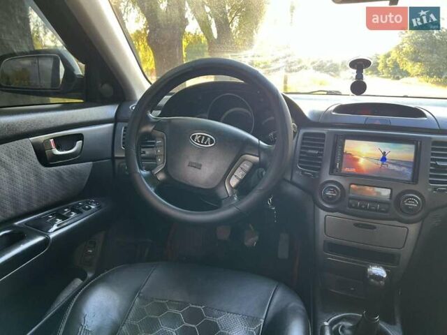 Чорний Кіа Маджентіс, об'ємом двигуна 2 л та пробігом 227 тис. км за 5650 $, фото 13 на Automoto.ua