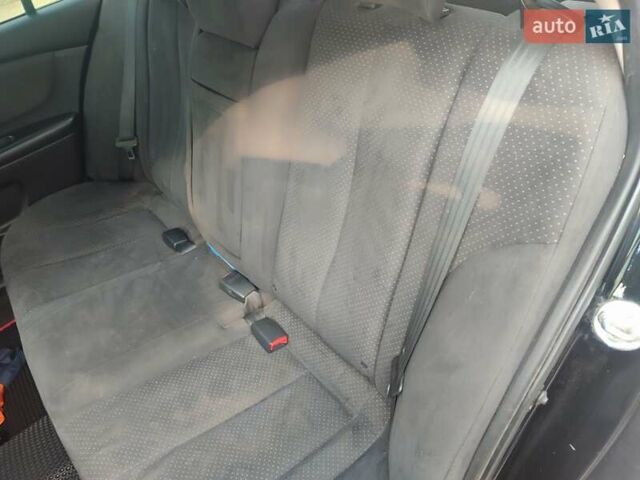 Черный Киа Маджентис, объемом двигателя 2 л и пробегом 257 тыс. км за 6500 $, фото 4 на Automoto.ua