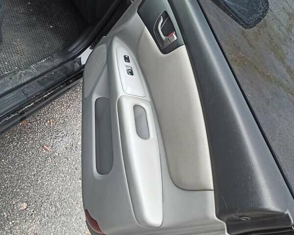 Черный Киа Маджентис, объемом двигателя 2 л и пробегом 226 тыс. км за 5500 $, фото 2 на Automoto.ua