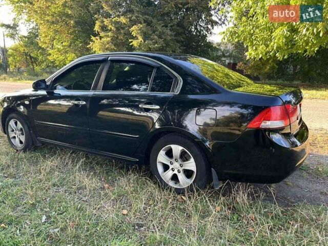 Чорний Кіа Маджентіс, об'ємом двигуна 2 л та пробігом 227 тис. км за 5650 $, фото 2 на Automoto.ua