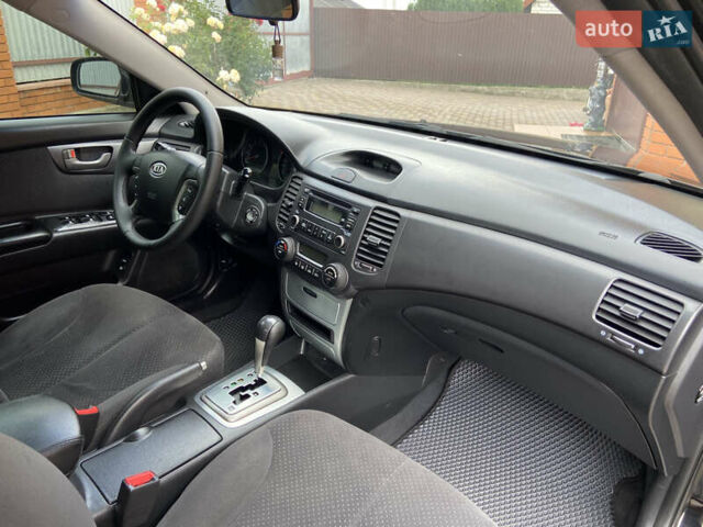 Черный Киа Маджентис, объемом двигателя 2 л и пробегом 170 тыс. км за 6450 $, фото 45 на Automoto.ua