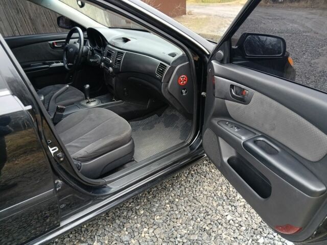 Чорний Кіа Маджентіс, об'ємом двигуна 2 л та пробігом 212 тис. км за 4950 $, фото 12 на Automoto.ua