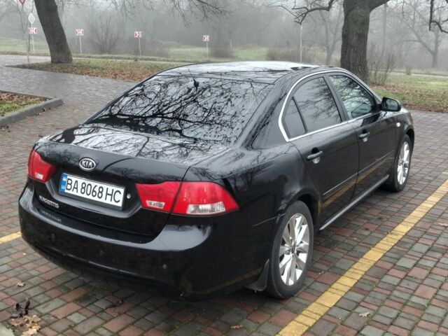 Чорний Кіа Маджентіс, об'ємом двигуна 2 л та пробігом 215 тис. км за 6700 $, фото 1 на Automoto.ua