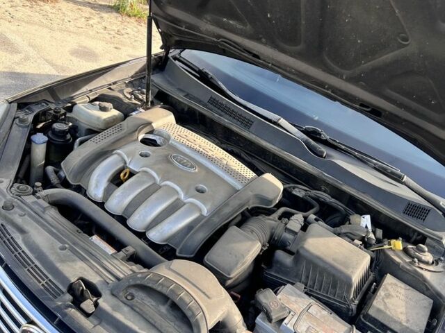 Коричневий Кіа Маджентіс, об'ємом двигуна 2 л та пробігом 310 тис. км за 5999 $, фото 11 на Automoto.ua