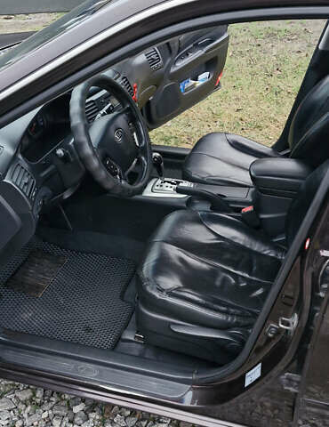 Коричневий Кіа Маджентіс, об'ємом двигуна 2 л та пробігом 458 тис. км за 4900 $, фото 4 на Automoto.ua