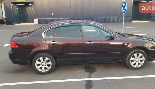 Коричневий Кіа Маджентіс, об'ємом двигуна 2 л та пробігом 278 тис. км за 5800 $, фото 4 на Automoto.ua