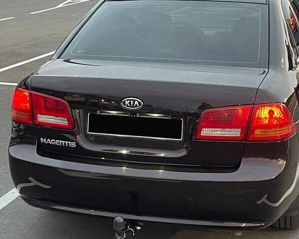Коричневий Кіа Маджентіс, об'ємом двигуна 2 л та пробігом 278 тис. км за 5800 $, фото 2 на Automoto.ua