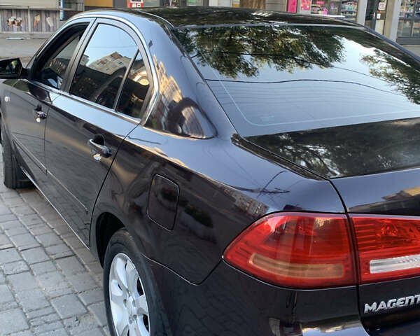 Коричневий Кіа Маджентіс, об'ємом двигуна 2 л та пробігом 200 тис. км за 5300 $, фото 3 на Automoto.ua