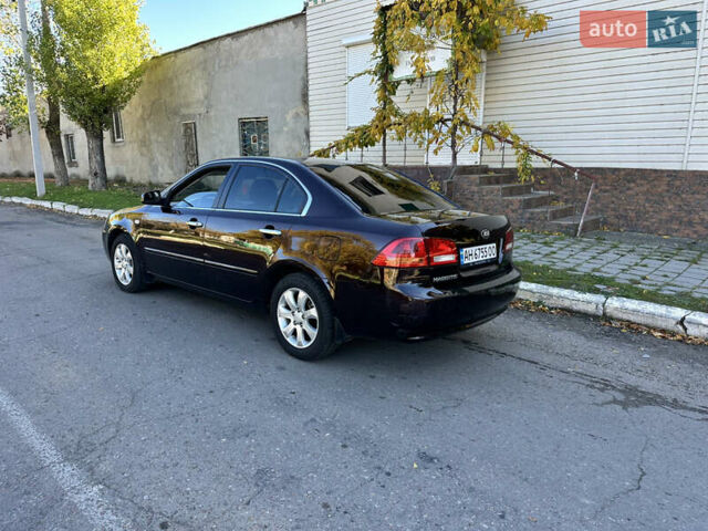 Коричневий Кіа Маджентіс, об'ємом двигуна 2 л та пробігом 191 тис. км за 4900 $, фото 5 на Automoto.ua