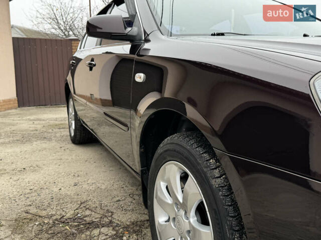 Коричневий Кіа Маджентіс, об'ємом двигуна 2 л та пробігом 157 тис. км за 5900 $, фото 16 на Automoto.ua