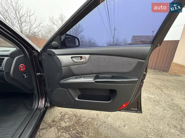 Коричневий Кіа Маджентіс, об'ємом двигуна 2 л та пробігом 157 тис. км за 5900 $, фото 32 на Automoto.ua
