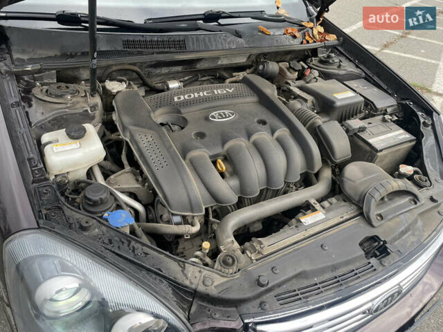 Коричневий Кіа Маджентіс, об'ємом двигуна 2 л та пробігом 170 тис. км за 6808 $, фото 13 на Automoto.ua