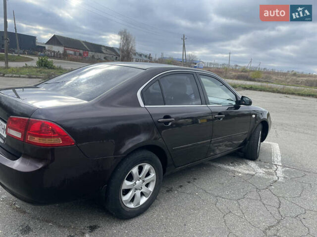 Коричневий Кіа Маджентіс, об'ємом двигуна 2 л та пробігом 170 тис. км за 6808 $, фото 3 на Automoto.ua