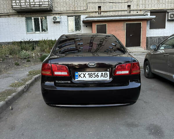 Коричневий Кіа Маджентіс, об'ємом двигуна 2 л та пробігом 180 тис. км за 5800 $, фото 6 на Automoto.ua