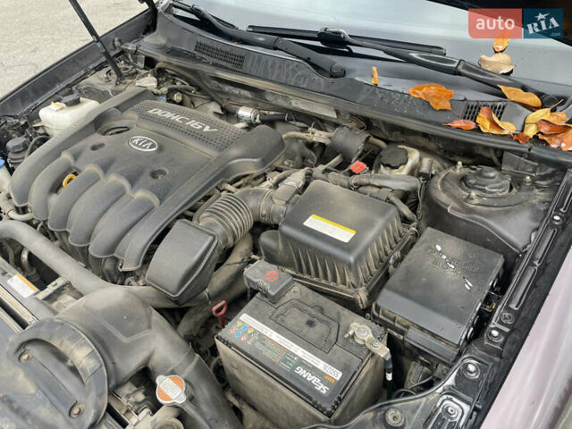 Коричневий Кіа Маджентіс, об'ємом двигуна 2 л та пробігом 170 тис. км за 6808 $, фото 12 на Automoto.ua