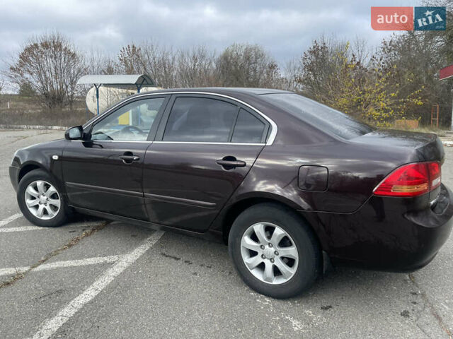 Коричневий Кіа Маджентіс, об'ємом двигуна 2 л та пробігом 170 тис. км за 6808 $, фото 4 на Automoto.ua