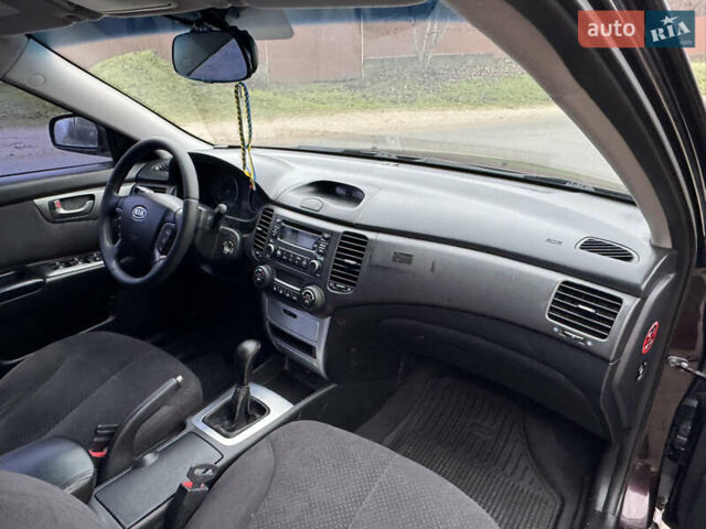 Коричневий Кіа Маджентіс, об'ємом двигуна 2 л та пробігом 157 тис. км за 5900 $, фото 23 на Automoto.ua