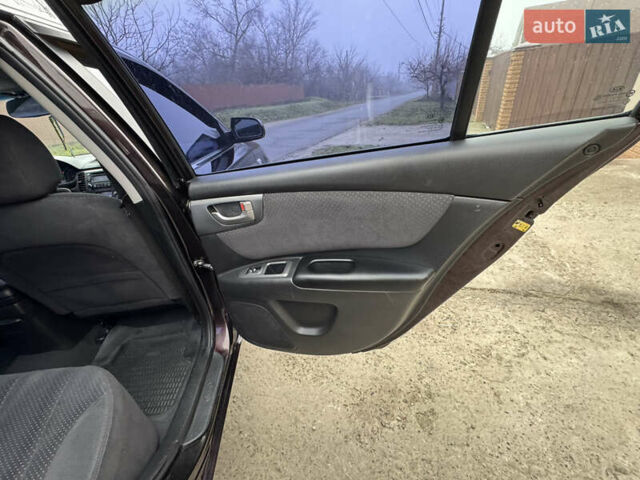 Коричневий Кіа Маджентіс, об'ємом двигуна 2 л та пробігом 157 тис. км за 5900 $, фото 33 на Automoto.ua