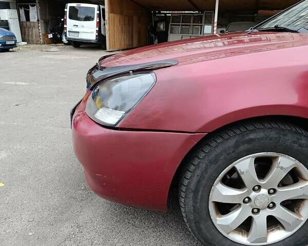 Кіа Маджентіс 2007 у Києві на Automoto.ua Червоний Кіа Маджентіс, об'ємом двигуна 2 л та пробігом 235 тис. км за 5000 $, фото 12 на Automoto.ua