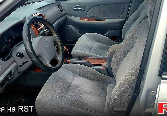 Сірий Кіа Маджентіс, об'ємом двигуна 2 л та пробігом 280 тис. км за 2700 $, фото 7 на Automoto.ua