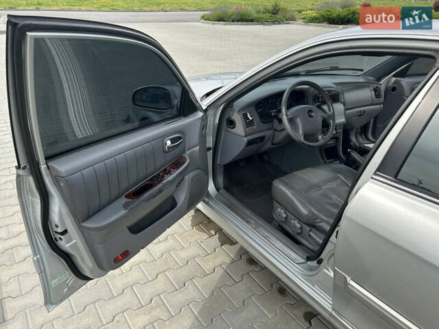 Сірий Кіа Маджентіс, об'ємом двигуна 2 л та пробігом 265 тис. км за 4700 $, фото 4 на Automoto.ua