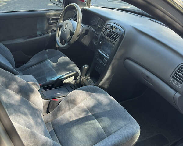 Серый Киа Маджентис, объемом двигателя 2 л и пробегом 175 тыс. км за 4500 $, фото 6 на Automoto.ua