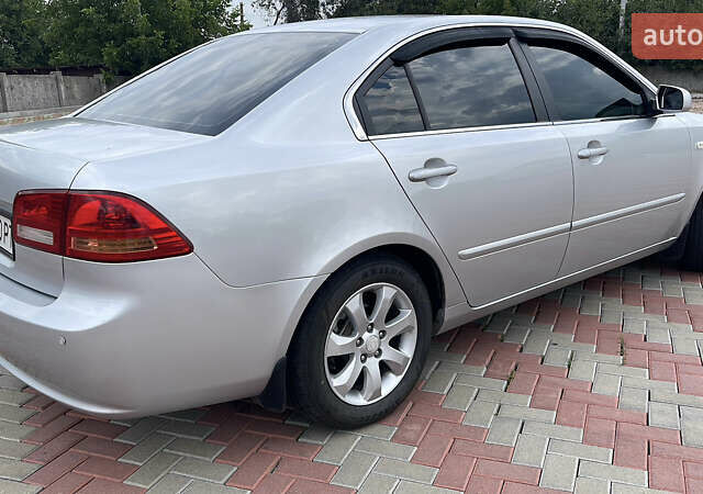 Сірий Кіа Маджентіс, об'ємом двигуна 2 л та пробігом 303 тис. км за 6500 $, фото 1 на Automoto.ua